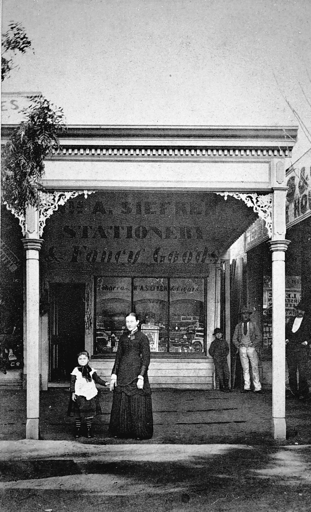 Negative - Woman & Child in Front of A. Siefker, Stationer & Fancy Goods, Echuca, Victoria, circa 1875
