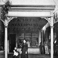 Negative - Woman & Child in Front of A. Siefker, Stationer & Fancy Goods, Echuca, Victoria, circa 1875