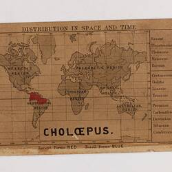 Retangular brown card with black and red text and map