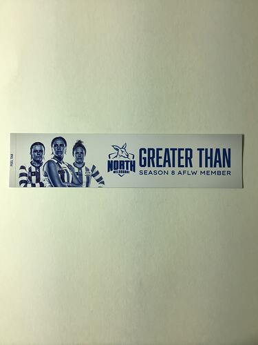 White strip sticker with 3 female footballers and blue text.