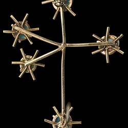 Back of white opal and gold brooch the shape of the southern cross. Stick pin open.