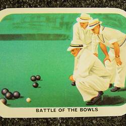 Card with three figures in white playing lawn bowls.