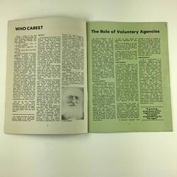 Open booklet. White (left) and pale green (right) page with black printing.