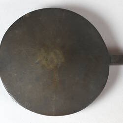 Detail of round weight, front view.