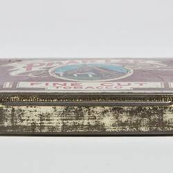 Rectangular maroon tobacco tin with brown racehorse head facing left. Text above and below.