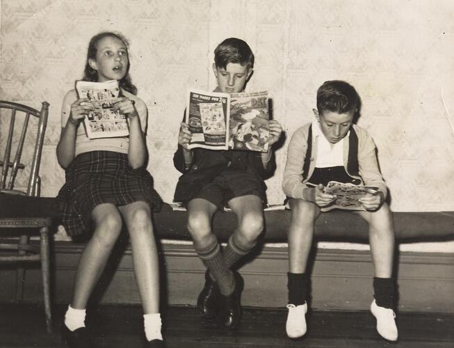Digital Photograph - Girl & Two Boys Reading Comics on Bench, South Melbourne, 1950-1959