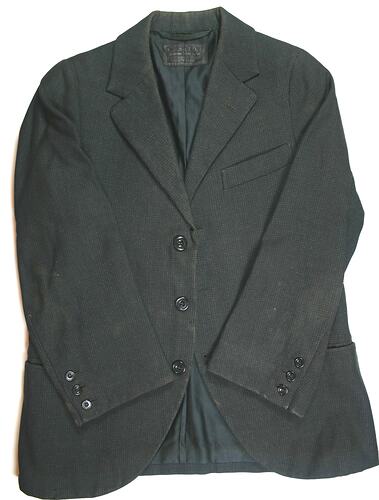 Worn black suit jacket, three buttons down front.