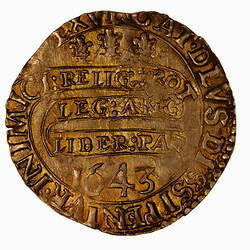 Coin, round, at centre within a beaded circle, three plumes; below on a continuous scroll text in three lines.