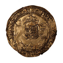 Coin, round, Edward VI enthroned facing holding a sword and orb; below, tudor rose partly removed from die.