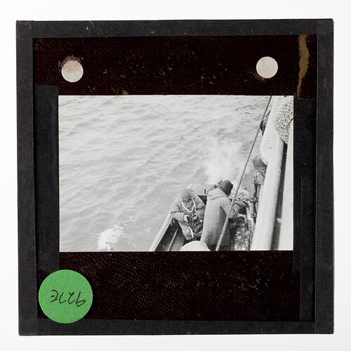 Lantern Slide - Two Explorers in a Motor Boat from Discovery II Ellsworth Relief Expedition, Antarctica, 1935-1936