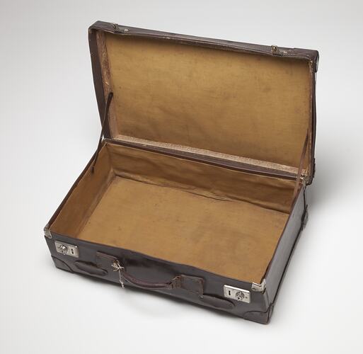 Lockable leather suitcase.