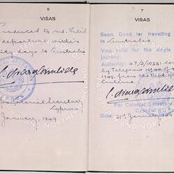 Open passport with white pages and black printing. Some handwriting. Stamped.
