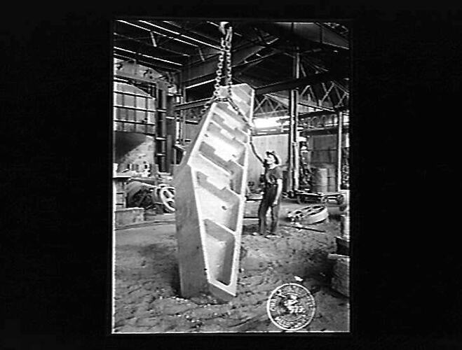 Black and white negative showing factory scene.