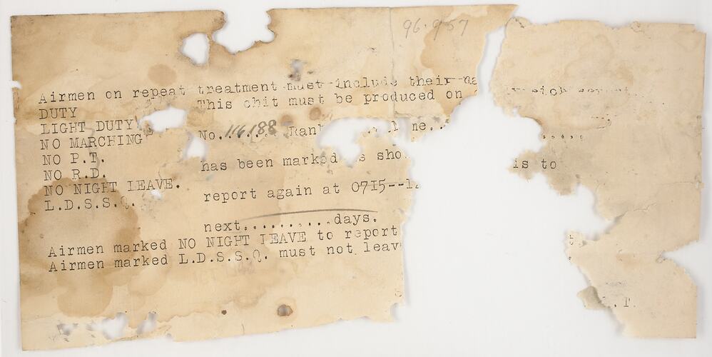 Extensively insect damaged sheet of paper with typewritten text. Large section of paper missing in middle.