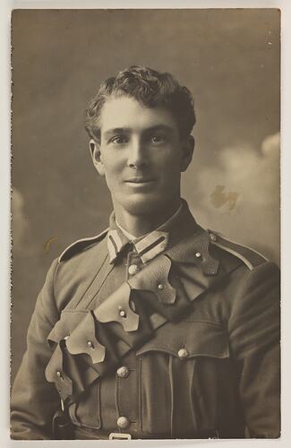 Studio portrait of man in military uniform.