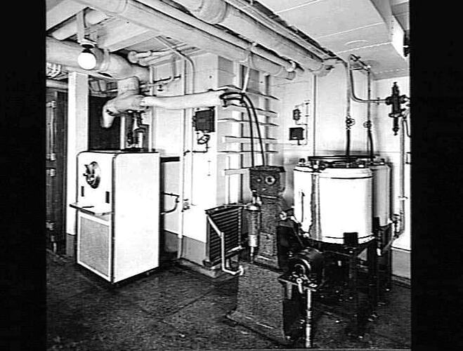 Ship interior. Kitchen with dairy refrigerator and equipment.
