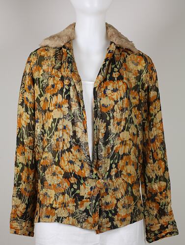 Yellow and green floral silk jacket with fur collar.
