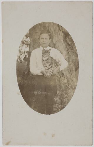 Portrait of a Boy Holding a Cat, circa 1915