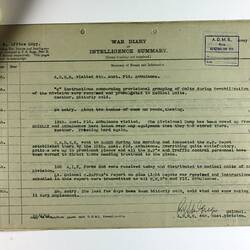 Paper with printed text and multiple written signatures, stapled to other pages in top-left corner.