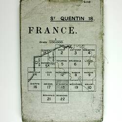 Map superimposed over a grid of squares, with text above.
