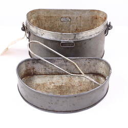 Metal tin with lid.