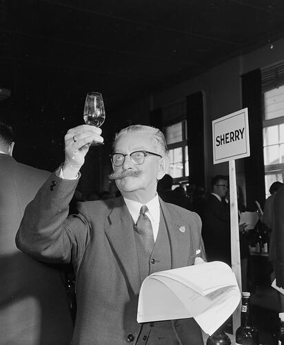 Australian News & Information Bureau, Man Tasting Alcohol, Royal Melbourne Showgrounds, Flemington, Victoria, 09 Sep 1959