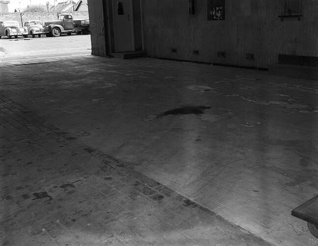 Monochrome photograph of a floor.