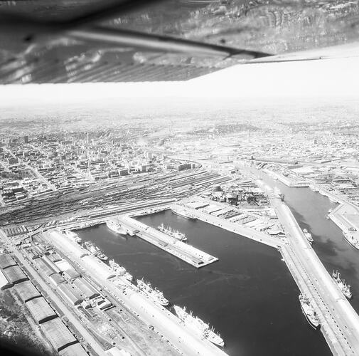 Monochrome aerial image of a shipping dock.