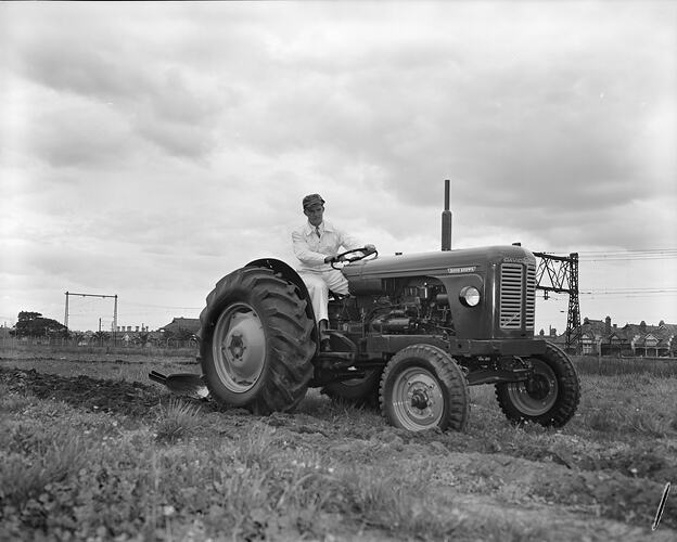 Man Ploughing Field with Tractor, Albert Park, Victoria, Sep 1958