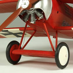 Red aeroplane model. Wheels detail.