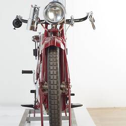 Red motor cycle, front view.
