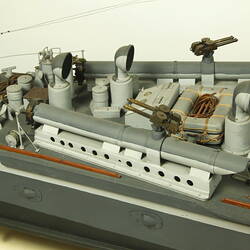 Dark and light grey ship, detail of rear of deck.