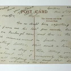 Printed back of postcard with handwiriting.