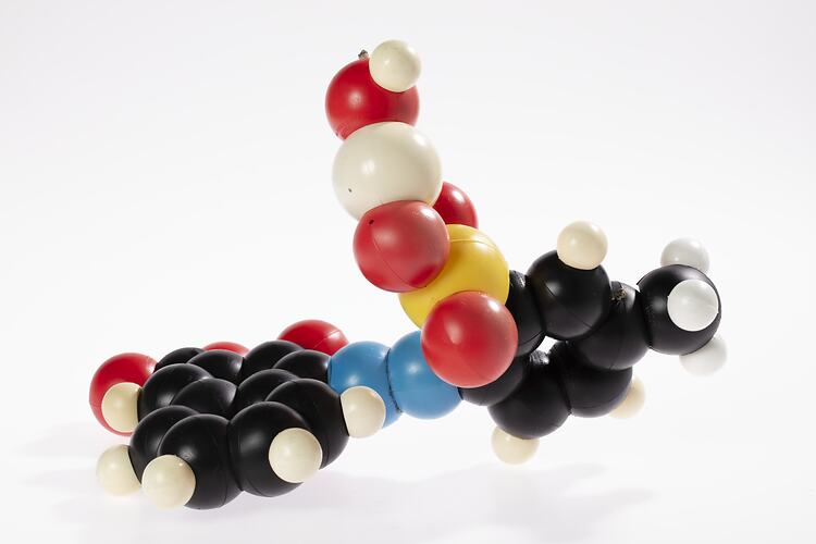 3D plastic model of molecular structure made up of coloured spheres.