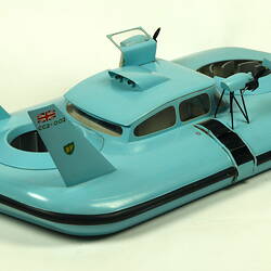 Light blue hovercraft with two propellers, three quarter view.