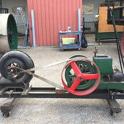 Engine and fan mounted on trolley frame.