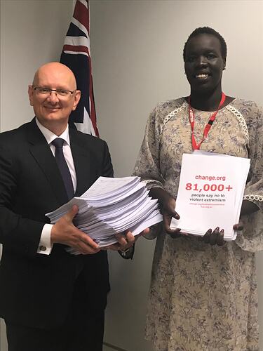 Nyadol Nyuon Presenting Petition To Federal Shadow Minister for Immigration Shayne Neumann, Parliament House, Canberra, 2018