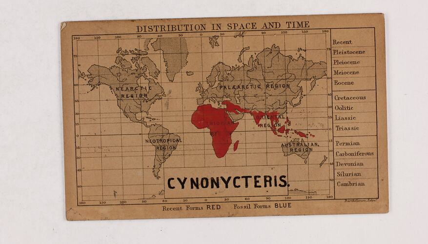 Retangular brown card with black and red text and map