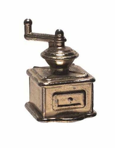 Cast metal toy coffee grinder with turning handle on top of drawer section.