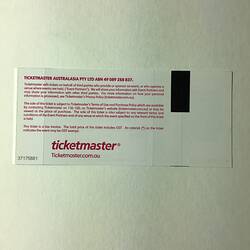 Back of white ticket with red printed text.