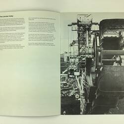 Open booklet. Black and white image of a coal dredge.