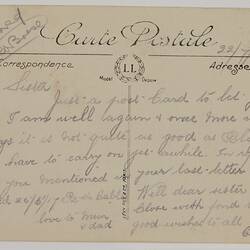 Printed back of postcard with handwriting.