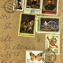 Detail of large brown envelope, covered with Soviet stamps dating between 1973 and 1986. Handwritten address.
