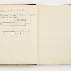 Open book with off white ruled pages. Handwritten text on left page.