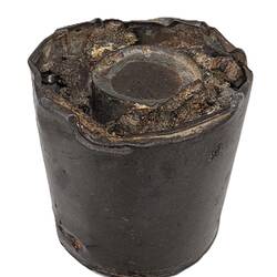 Side view of metal jam tin grenade.