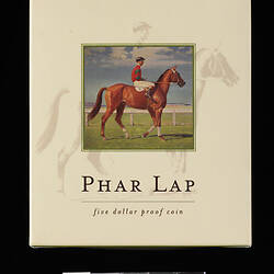 Cream box with picture of race horse.