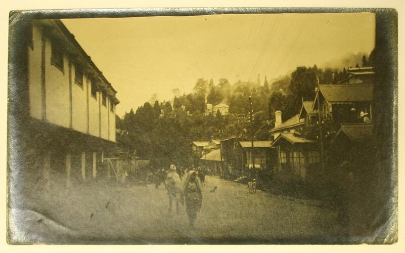 View of people and buildings in Darjeeling bazaar.