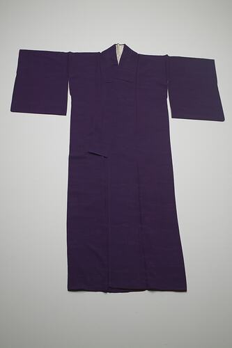 Purple silk kimono laid out flat.