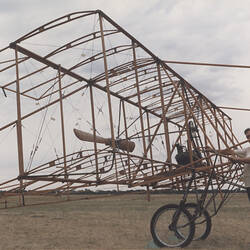 Photograph - Ron Lewis with Airframe of Replica Duigan Biplane, Mangalore, Victoria, 1988