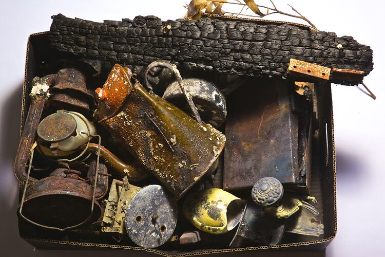 Digital photograph - Box of bushfire-affected objects, Mar 2009.